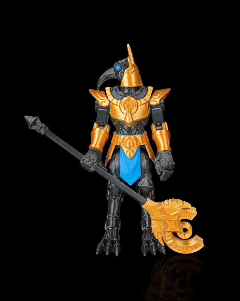 Front view of a black and gold bird-headed armored figurine holding a long staff on a black background.