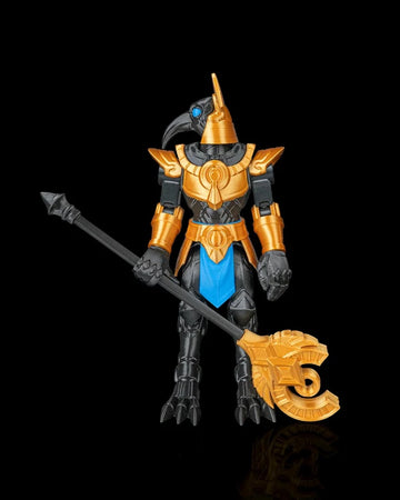 Front view of a black and gold bird-headed armored figurine holding a long staff on a black background.