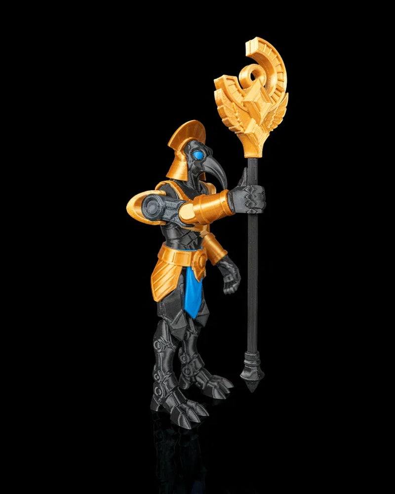 Angled side view of a bird-headed armored figurine holding a vertical staff with a gold top on a black background.