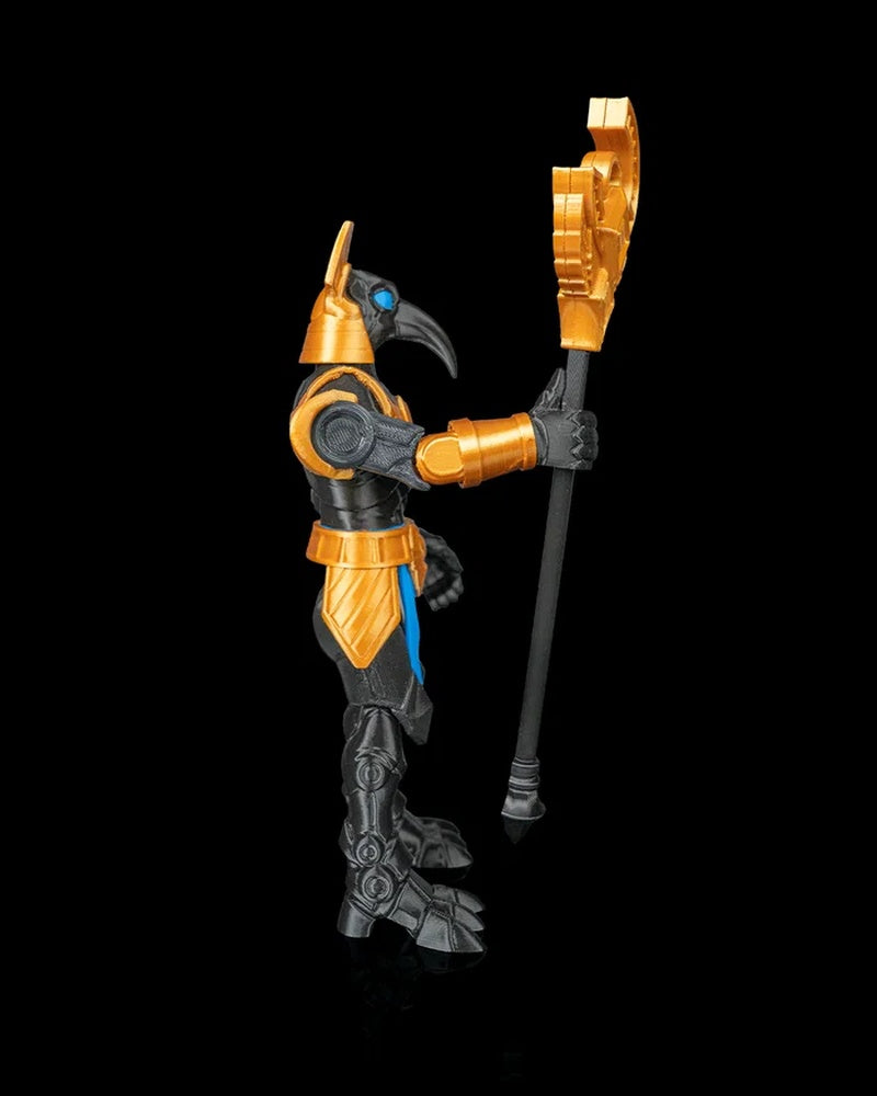 Side view of a black and gold bird-headed armored figurine holding a vertical staff on a black background.