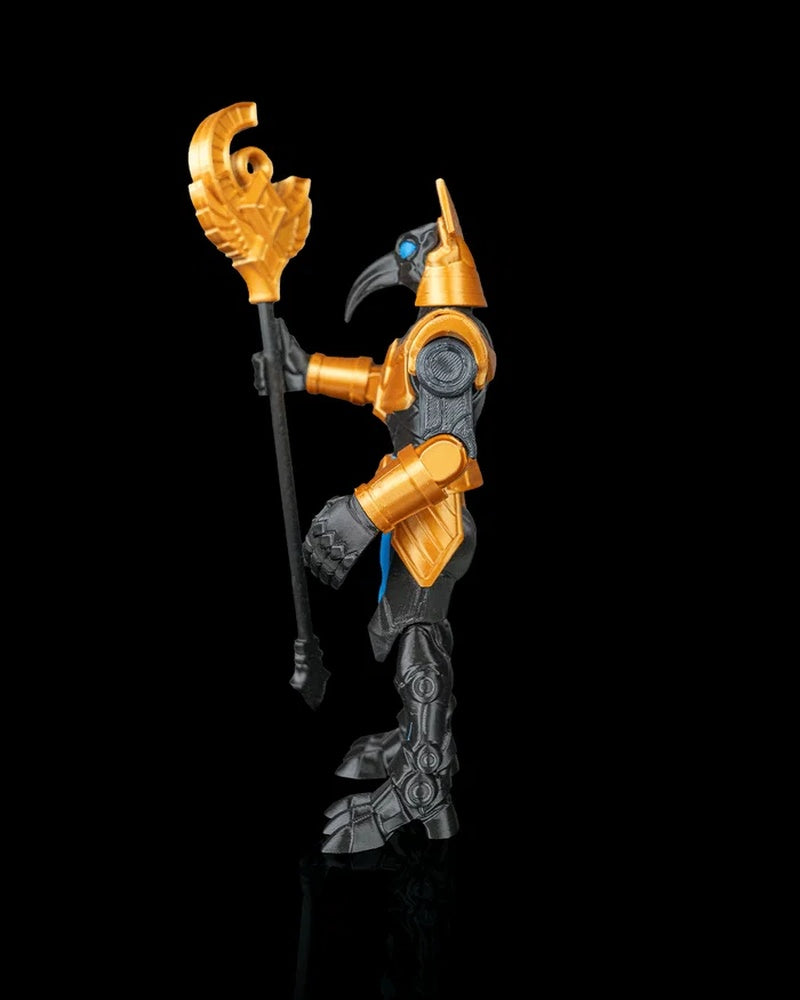 Side view of a bird-headed armored figurine with gold armor and a vertical staff on a black background.
