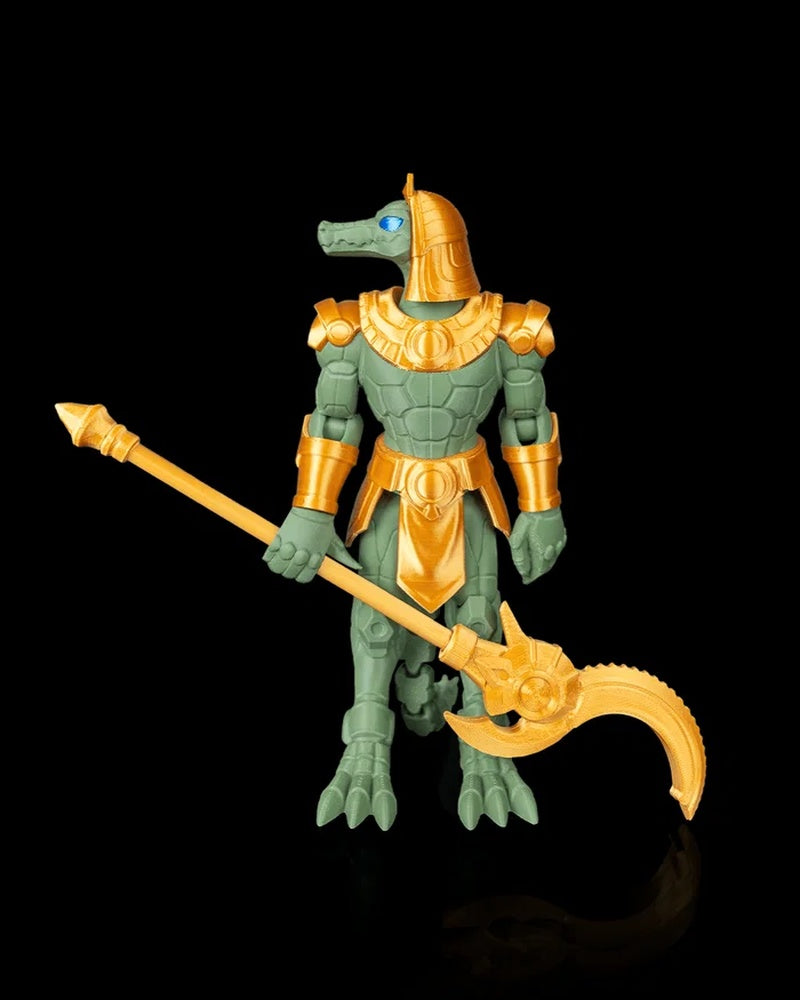 Front view of a green crocodile-headed armored figurine holding a gold-colored curved polearm on a black background.