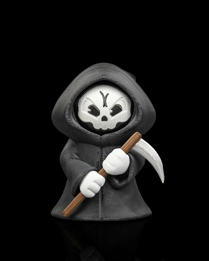 Hooded reaper figure holding a scythe with an angry skull face on a black background