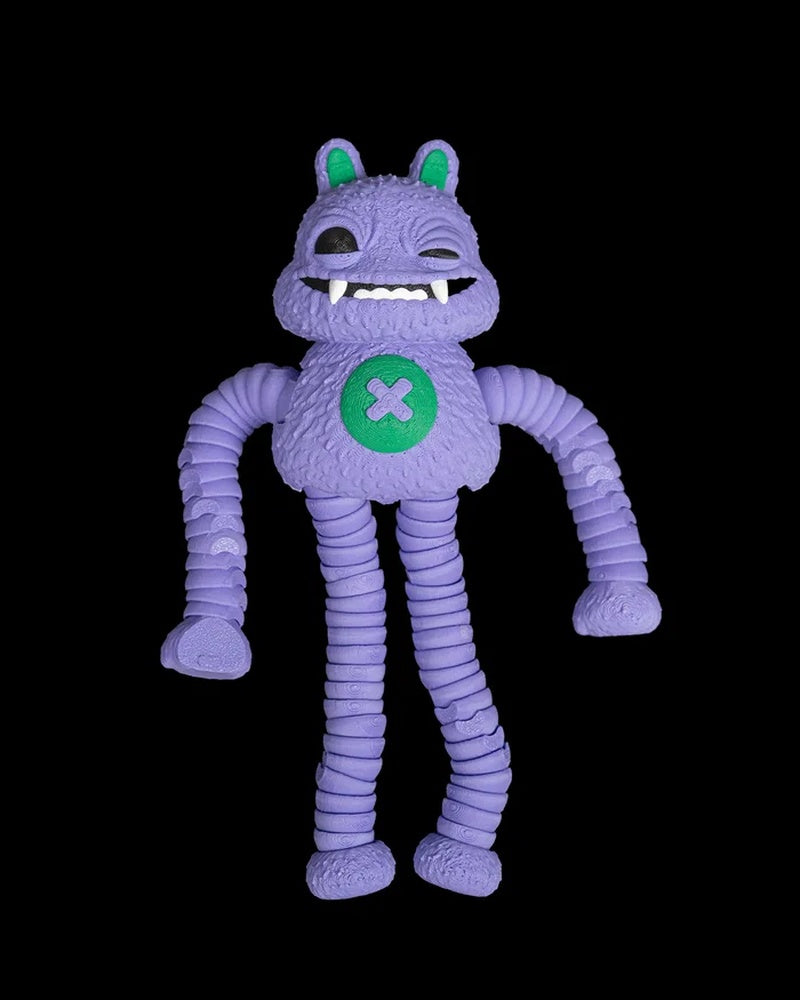 Purple monster figurine with long ribbed arms, rounded ears, white teeth, and a green belly patch on a black background