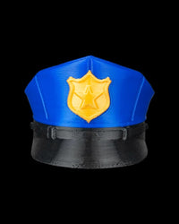 Front view of a blue cap with a black brim and gold badge accent on a black background