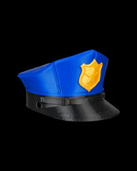 Side view of a blue cap with a black brim and gold badge accent on a black background