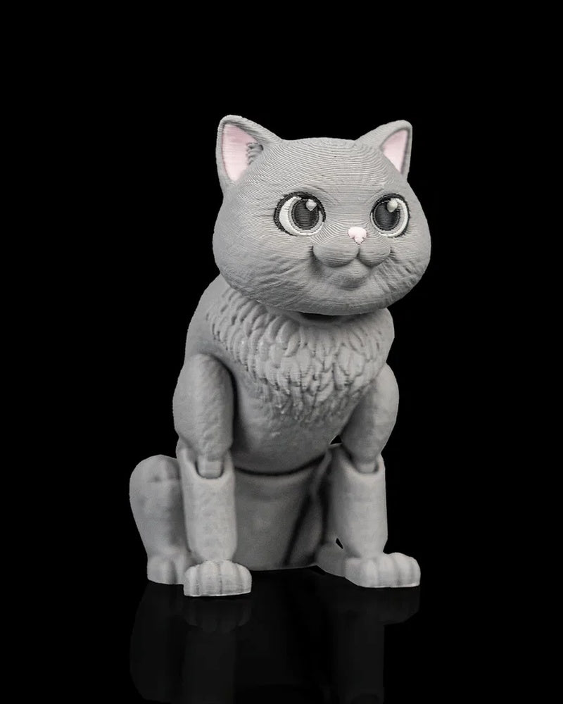 Gray cat figurine shown from a front angle with a seated pose and pink nose.