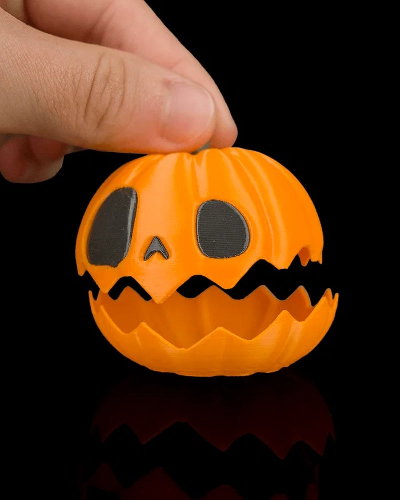 Hand lifting the top of an orange pumpkin with a jagged opening