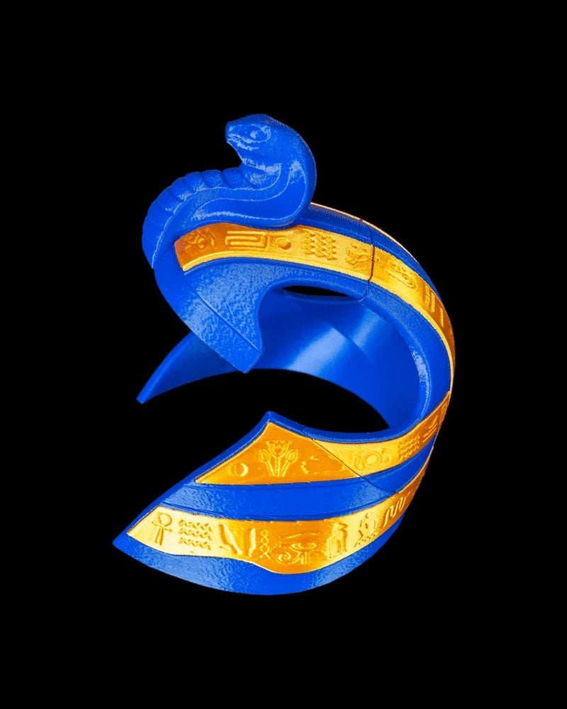 Side view of a blue and gold pharaoh-style headpiece on a black background