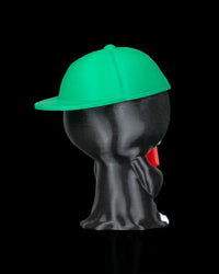 Back view of a hooded skull figurine with a green cap and black robe