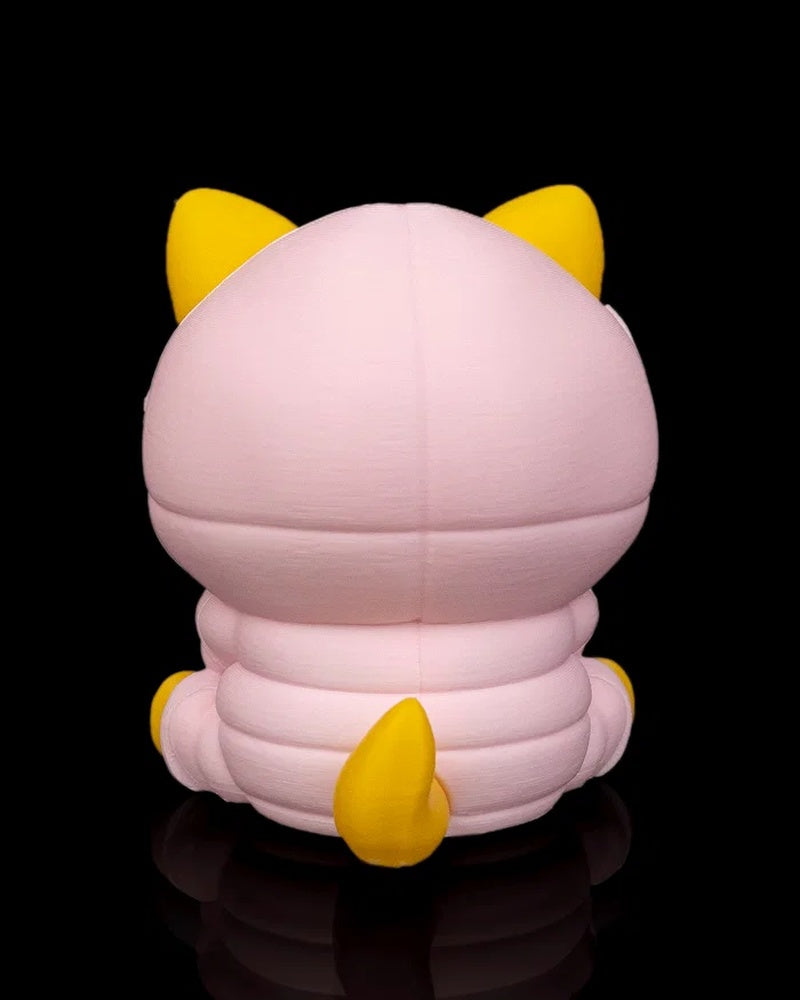 Back view of a yellow dog figurine wearing a pink hood with a yellow tail on a black background.