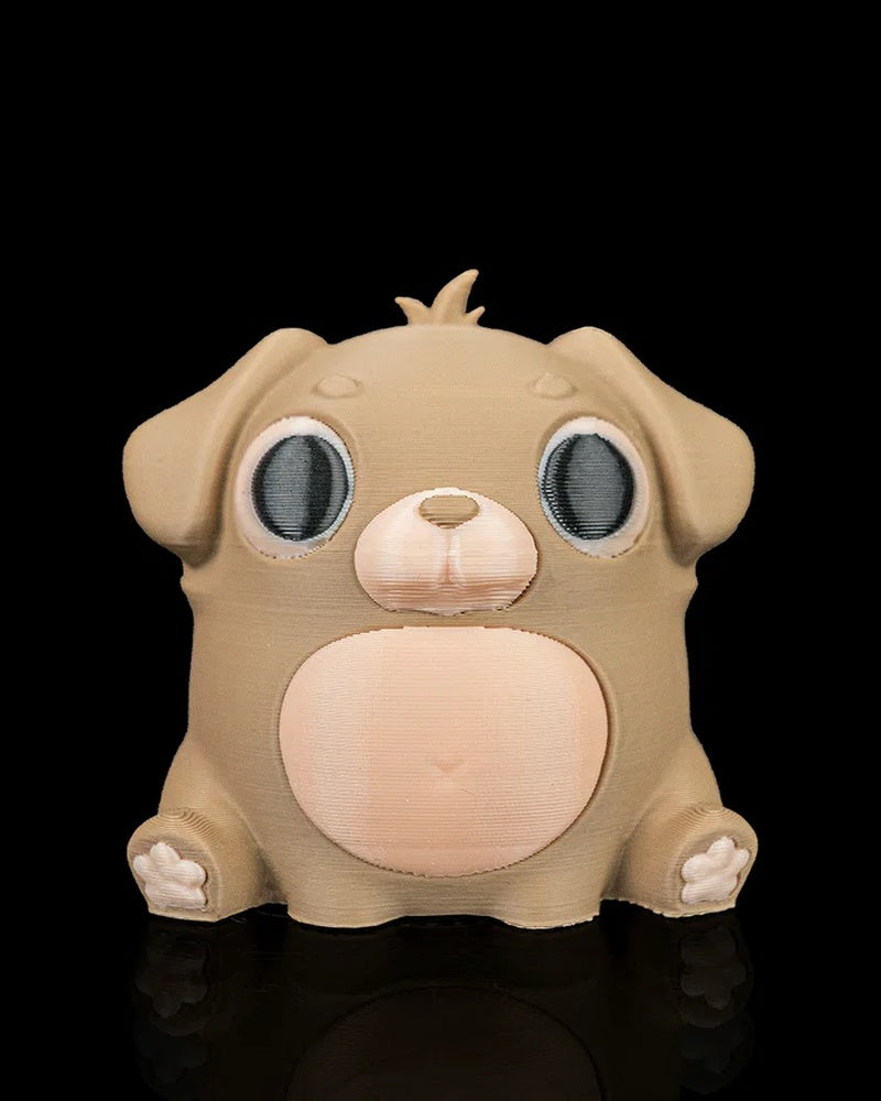 Front view of a tan puppy figure with floppy ears, large dark eyes, pale muzzle, and round belly on a black background.