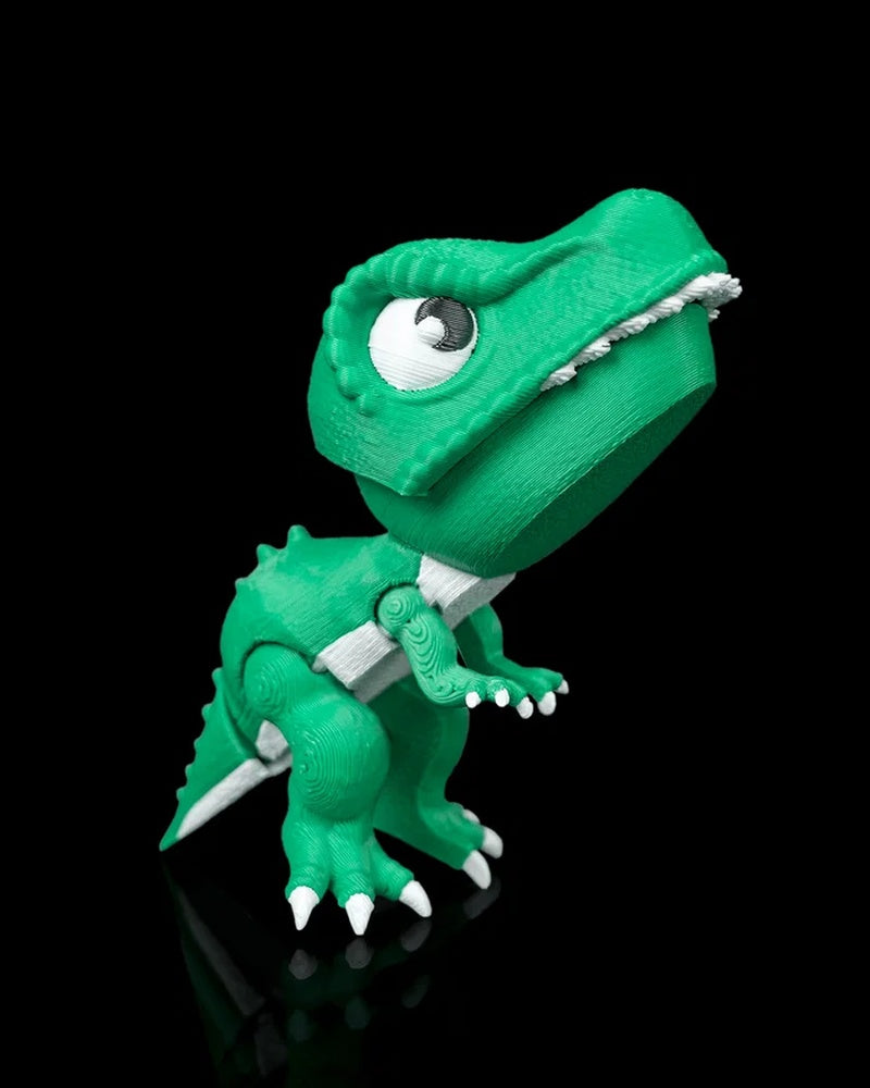 Green dinosaur toy with large eyes, white teeth, claws, and tail on a black background