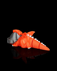 Rear angled view of an orange dragon figurine with white back spikes, wings, tail, and gray helmet