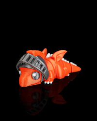 Angled front view of an orange dragon figurine with gray visor, white eyes, wings, and tail