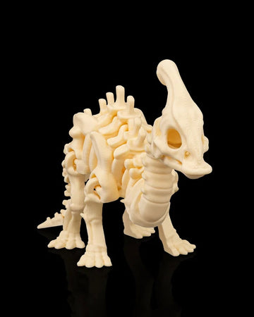 Cream-colored skeleton dinosaur figurine with a tall head crest standing on a black reflective surface