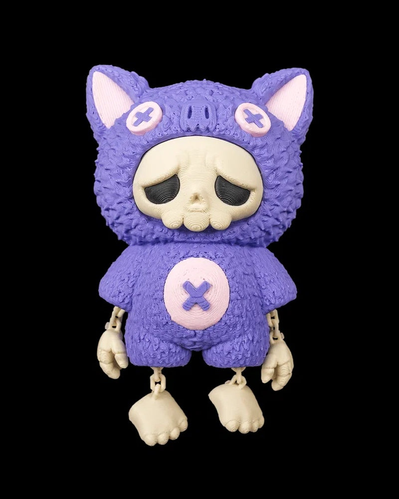 Purple bat-themed skull figurine with dangling arms and legs on a black background