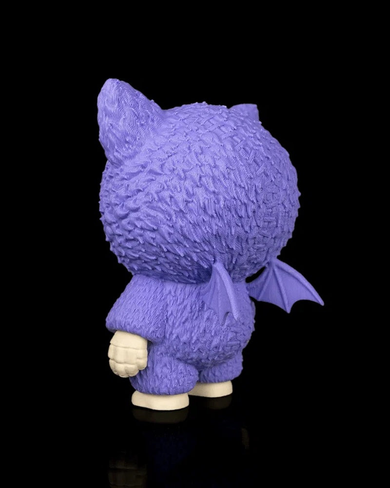 Rear angled view of a purple bat-themed skull figurine with small wings and textured surface