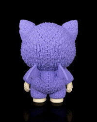 Back view of a purple bat-themed skull figurine with small wings on a black background