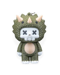 Front view of a green horned dinosaur character with a white skull face and X-shaped eyes.