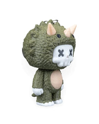 Side view of a green horned dinosaur character with pale horns and a rounded belly.