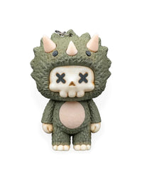 Front view of a green horned dinosaur character with cream skull face, X-shaped eyes, and pale belly.