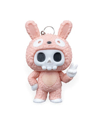 Front view of a pink bunny-suit skull character with tall ears and a raised peace-sign hand