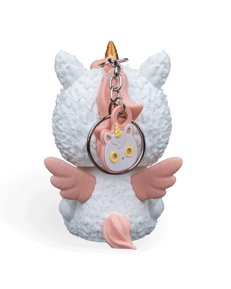 Back view of a white unicorn costume figurine with pink wings, pink tail, and a metal ring and chain
