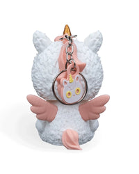Back view of a white unicorn costume figurine with pink wings, pink tail, and a metal ring and chain