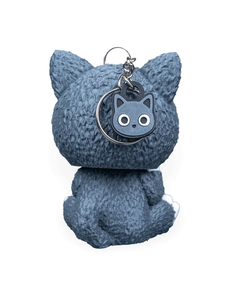 Back view of a gray cat costume character with a round cat tag and metal ring