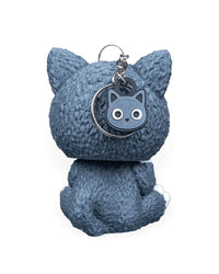 Back view of a gray cat costume character with a round cat tag and metal ring