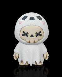 Front view of a white ghost skull figurine with black X eyes, pink cheeks, and a ragged robe on a black background.