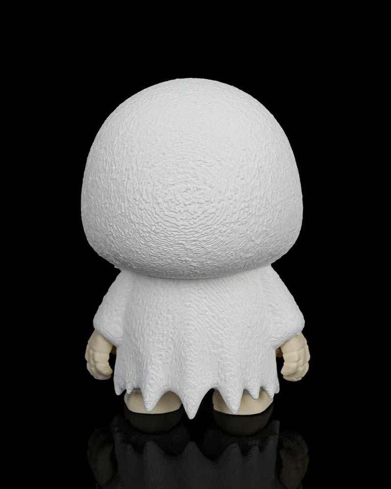 Back view of the white ghost skull figurine showing the rounded hood and ragged robe on a black background.