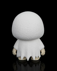 Back view of the white ghost skull figurine showing the rounded hood and ragged robe on a black background.