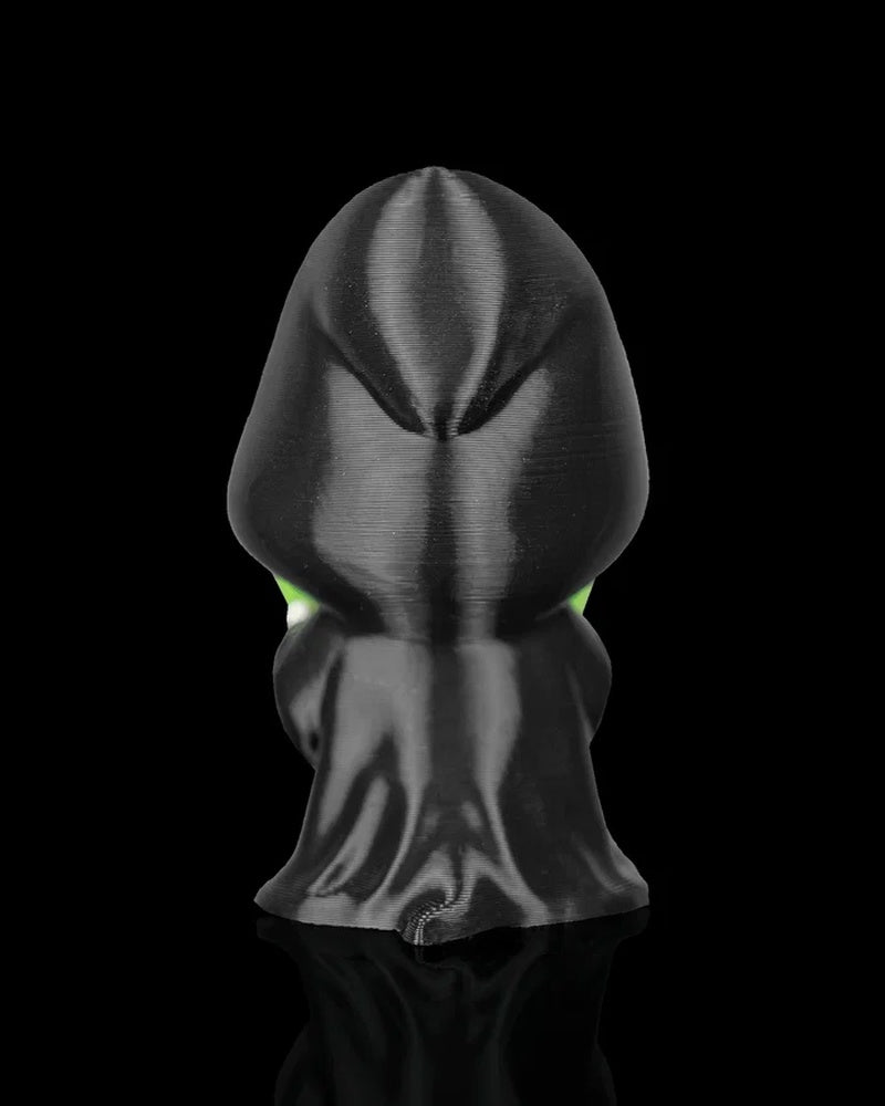 Back view of a black hooded robe figurine on a black background