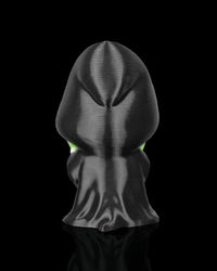 Back view of a black hooded robe figurine on a black background