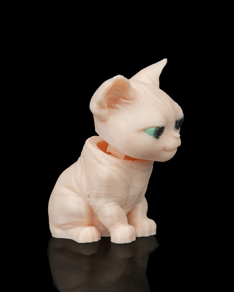 Pale seated sphynx cat figure with large ears and dark-and-mint eyes on a black background