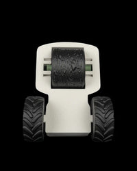 Top view of an off-white tractor-shaped tool with a black textured roller between two black wheels.