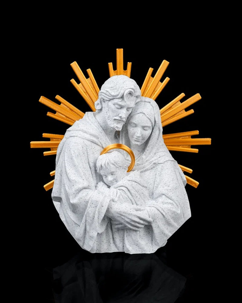 White Holy Family figurine with gold-tone rays and halo accents on a black background
