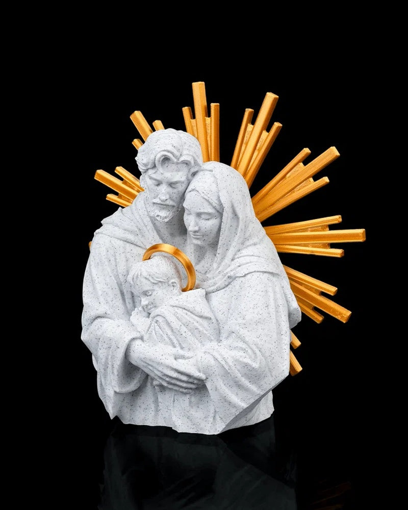 Angled view of a white Holy Family figurine with gold-tone rays behind the figures