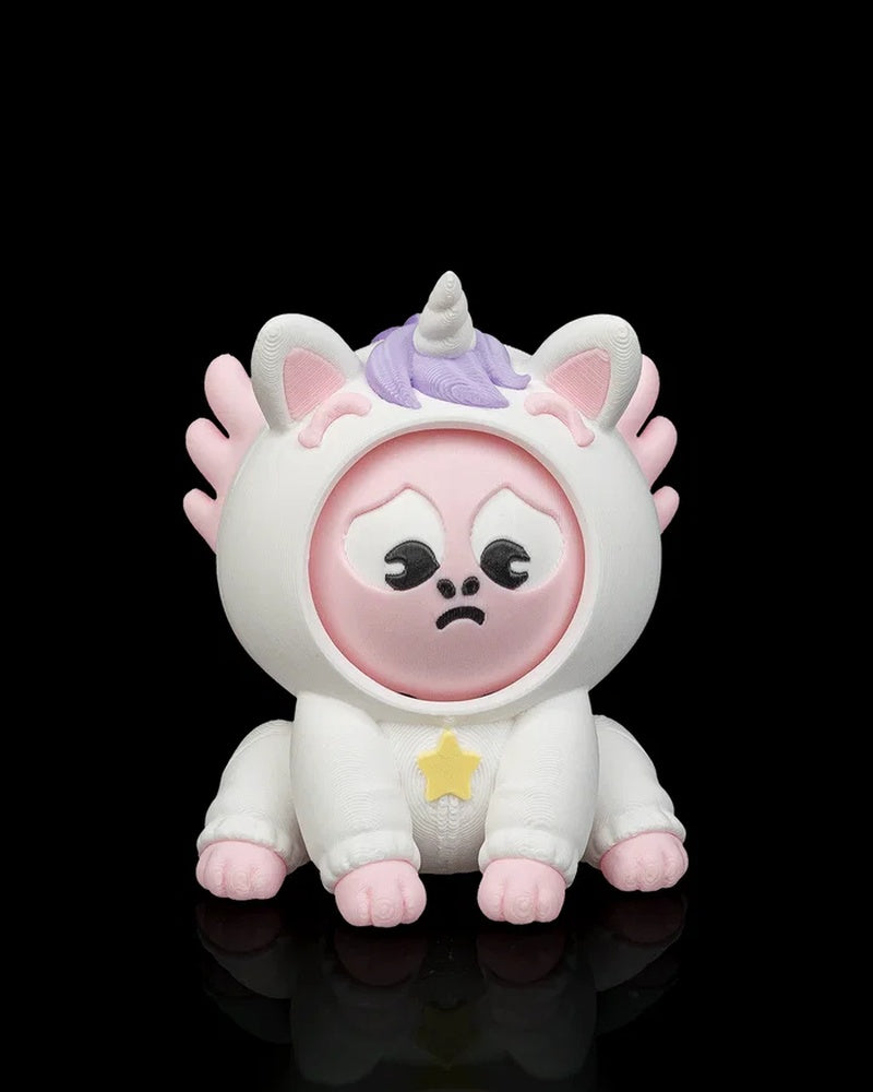 Front view of a white unicorn axolotl character with a sad pink face, purple mane, horn, pink frills, and yellow star accent on a black background