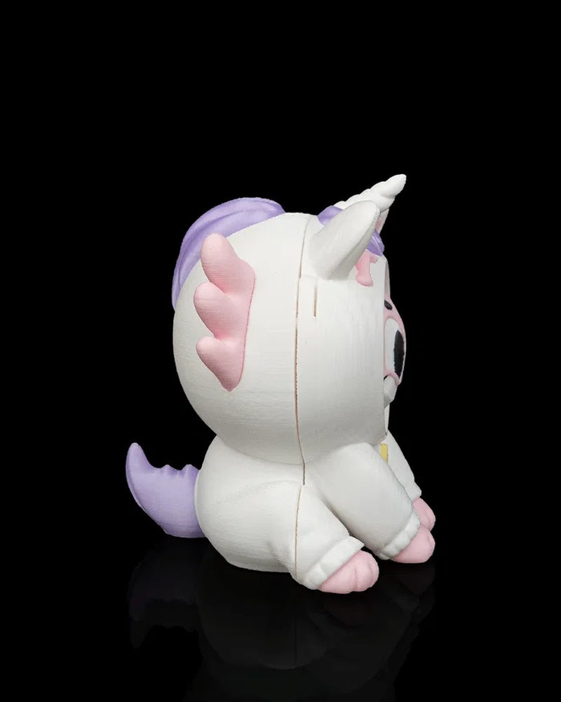 Side view of a white unicorn axolotl character with pink frills, purple tail, horn, and pink paws on a black background