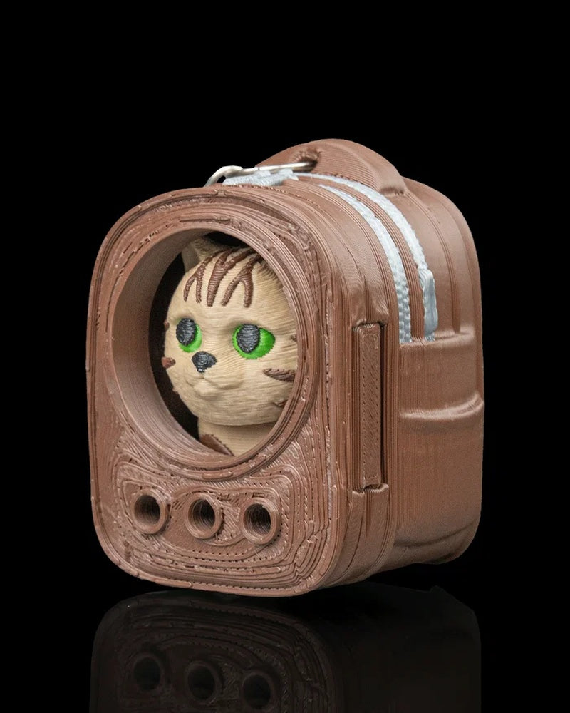 Angled view of a brown backpack-shaped carrier with a tabby cat face inside