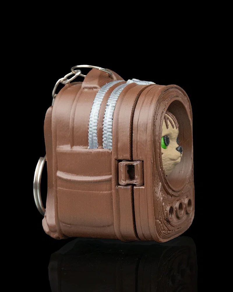 Side view of a brown backpack-shaped carrier with a cat face visible through the front opening
