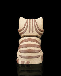 Back view of a cream and brown striped tabby cat figurine