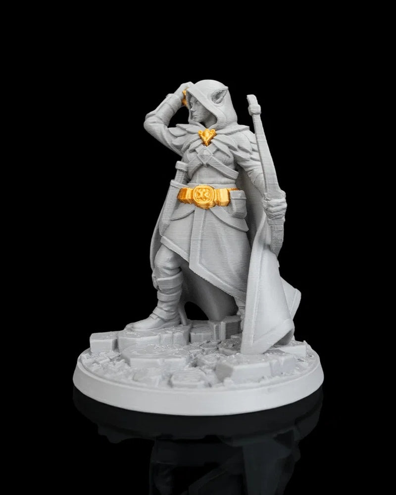 Side view of hooded archer figurine with cloak, bow, gold-colored belt accent, and round base