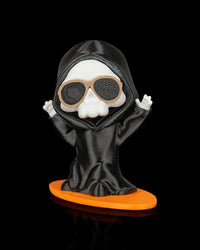 Ghost figurine wearing a black hooded robe and tan sunglasses on an orange board base